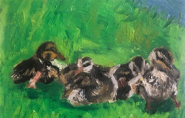 A painting of baby ducks in the grass.